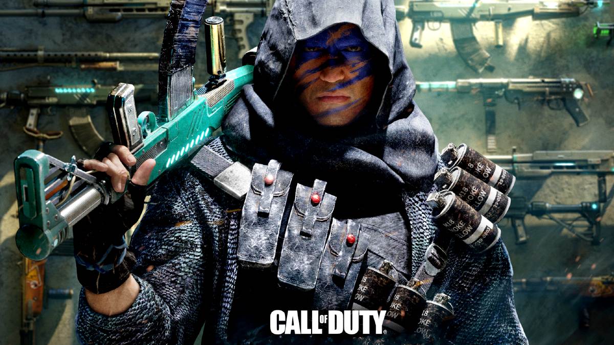 A Call of Duty soldier stands with a blue rifle in his right hand. He stares at the camera and wears a hood.