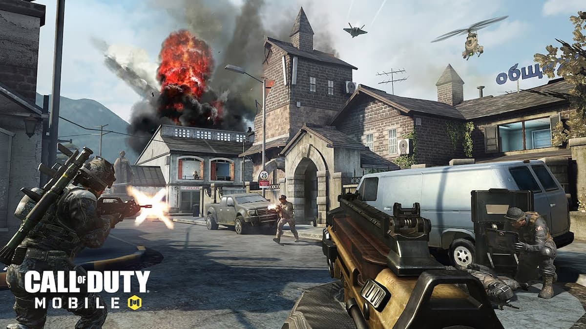 soldiers in Call of Duty mobile running around a town and shooting. There is an explosion in a nearby building