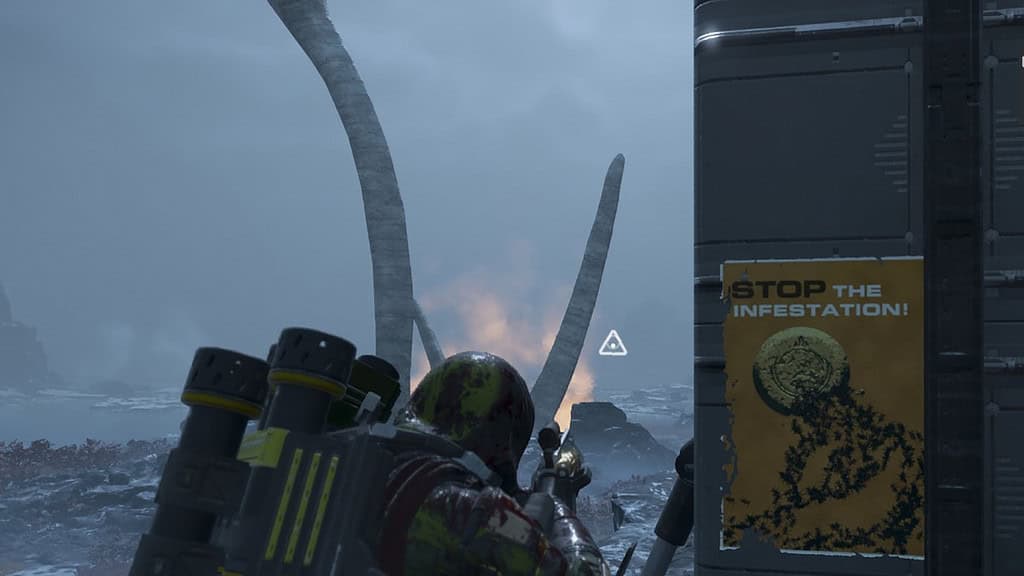 Helldivers 2 players standing in front of a poster