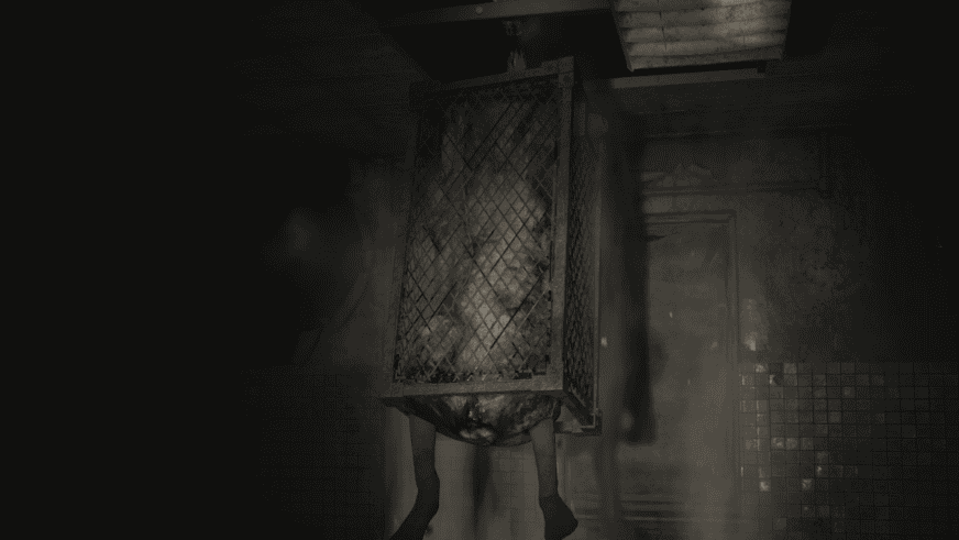 Playstation Silent Hill 2 remake cage hanging from a ceiling with a monster inside