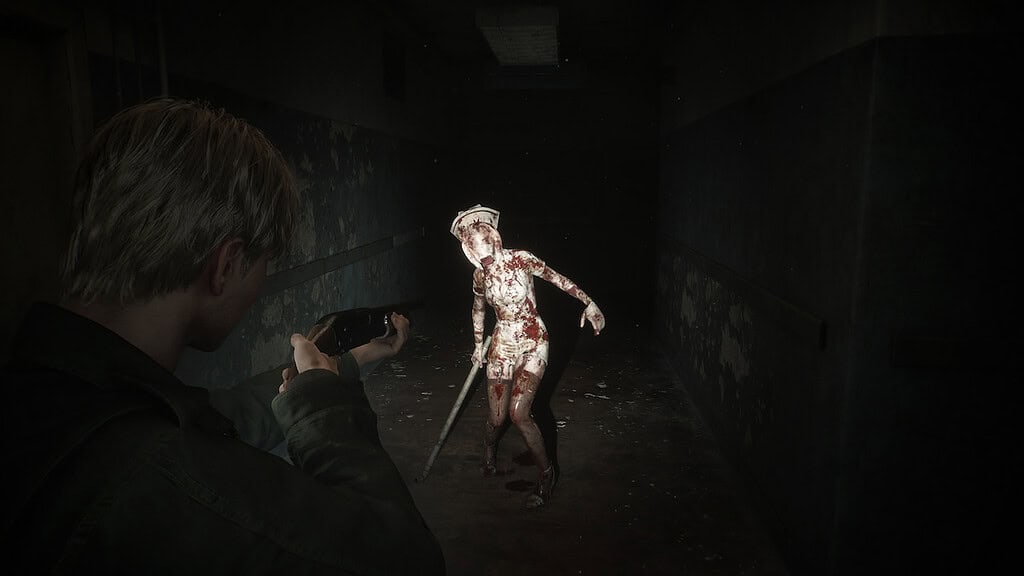 Playstation Silent Hill 2 remake protagonist aiming a shotgun at the nurse