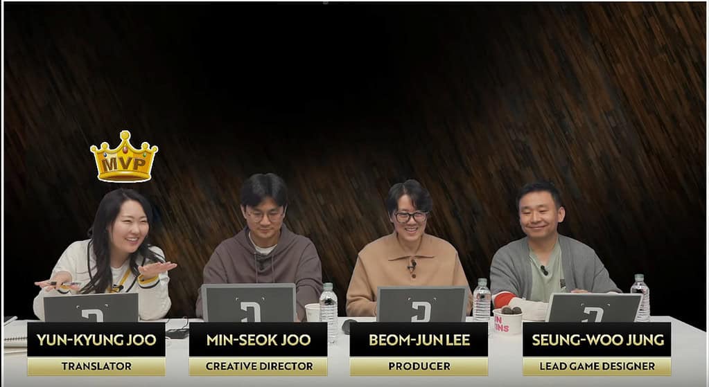 The First Descendant devs during Season 2 Live Broadcast with Yun-Kyung Joo wearing an MVP golden crown