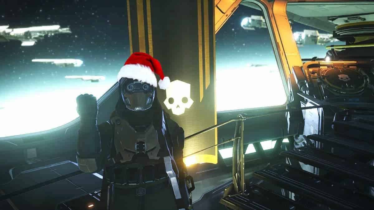 Helldivers 2 player with a Santa hat doing a Super Earth Salute.